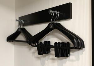 a black hanger with some cooking utensils in it at APA Hotel Hakata Ekimae 2Chome in Fukuoka
