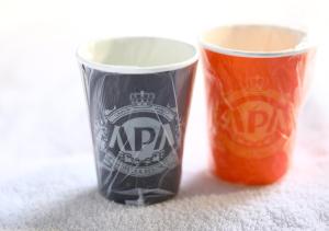 two cups sitting next to each other on the floor at APA Hotel Hakata Ekimae 2Chome in Fukuoka