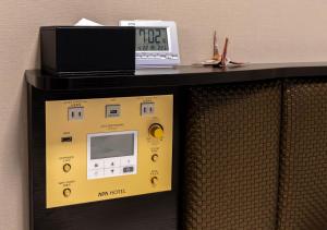 a machine with a clock on top of it at APA Hotel Hakata Ekimae 2Chome in Fukuoka