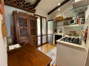 a kitchen with a stove and a counter top at Casa ai Poggi dell'Argentario in Orbetello