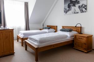 A bed or beds in a room at Chalet Nova Lesna Mountain View