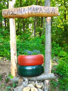 a sign that says eastern marseilles with two colorful tires at Cascina Marasca Appartamento Viola in Martina Olba