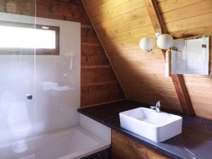 a bathroom with a white sink and a shower at Kosarzówka in Bielsko-Biała