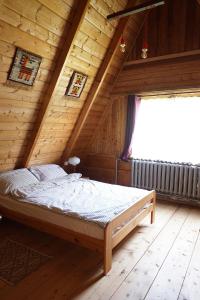 Postel nebo postele na pokoji v ubytování Kosarzówka