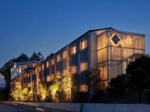 a large building with lights on the side of it at Yukari no Mori in Fujikawaguchiko