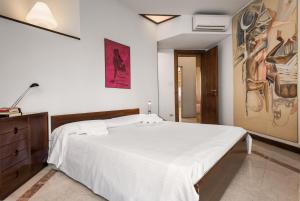 Posteľ alebo postele v izbe v ubytovaní Flats4rent Residenza ai Tigli