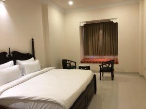 Voodi või voodid majutusasutuse Hotel Raj Bagh Palace toas