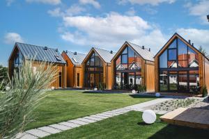 a house with a lot of windows at Villa Baltica in Niechorze