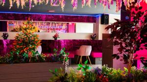 a room filled with lots of plants and flowers at Hello Roomz - Pleasure Beach in Blackpool