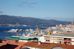 a view of a city with a harbor at Hotel Coia de Vigo in Vigo