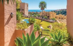 a view from the balcony of a resort with plants at 2311-modern apt with sea and pool views in San Luis de Sabinillas