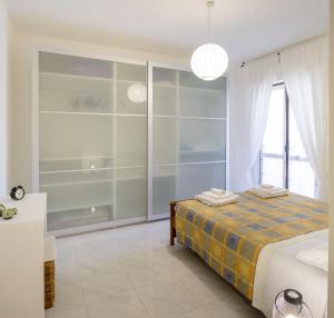 A bed or beds in a room at Appartamento Zappacenere