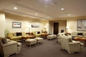a waiting room with couches and chairs and tables at Hotel Coia de Vigo in Vigo