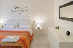 A bed or beds in a room at Appartamento Zappacenere