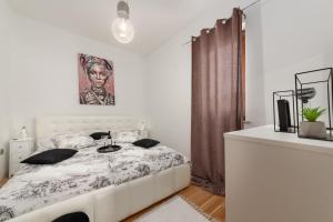 Postel nebo postele na pokoji v ubytování Lento Apartment