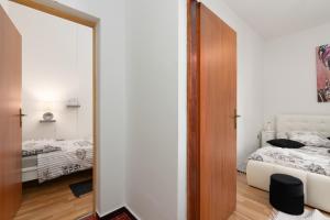 Postel nebo postele na pokoji v ubytování Lento Apartment