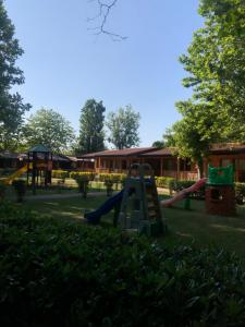 a park with a playground with slides at Villaggio Samoa in Lido delle Nazioni