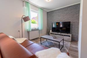 TV a/nebo společenská místnost v ubytování Haus Kormoran Borkum