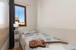 Postel nebo postele na pokoji v ubytování Lento Apartment