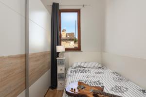 Postel nebo postele na pokoji v ubytování Lento Apartment