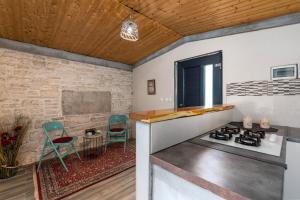 Kuchyň nebo kuchyňský kout v ubytování Lento Apartment