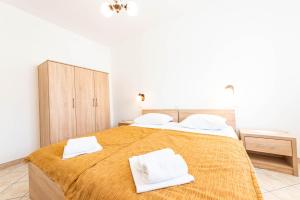 Postel nebo postele na pokoji v ubytování Apartments Cvito