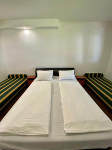 מיטה או מיטות בחדר ב-Amarin Apartments