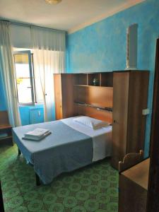 Voodi või voodid majutusasutuse Albergo Stella Di Mare toas
