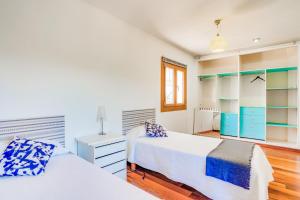 Postel nebo postele na pokoji v ubytování Villa Portals Nous 2