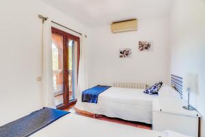 Postel nebo postele na pokoji v ubytování Villa Portals Nous 2