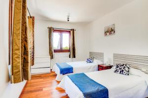 Postel nebo postele na pokoji v ubytování Villa Portals Nous 2