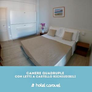 Postel nebo postele na pokoji v ubytování Hotel Caravel