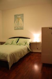 a bedroom with a bed with a light on the wall at Lux Villa in Rijeka +39 photos