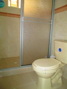 a bathroom with a toilet and a shower at Haynes Cay View in San Andrés