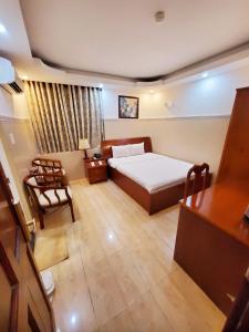 Postel nebo postele na pokoji v ubytování Thanh An Hotel