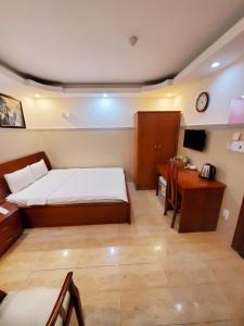 Postel nebo postele na pokoji v ubytování Thanh An Hotel