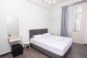 Ένα ή περισσότερα κρεβάτια σε δωμάτιο στο OPL Executive Apartment