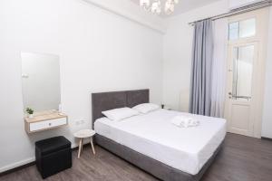 Posteľ alebo postele v izbe v ubytovaní OPL Executive Apartment