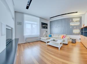 a living room with a white couch and a table at Apartment light in Pula in Pula