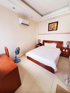 Postel nebo postele na pokoji v ubytování Thanh An Hotel