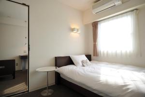 Ένα ή περισσότερα κρεβάτια σε δωμάτιο στο 7 Days Hotel Plus
