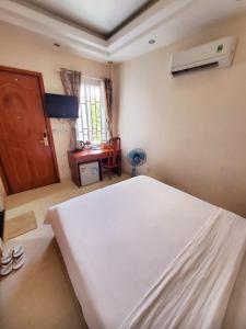 Postel nebo postele na pokoji v ubytování Thanh An Hotel