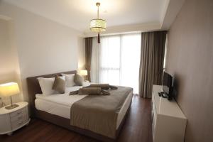 Postel nebo postele na pokoji v ubytování Paşapark Selçuklu Hotel