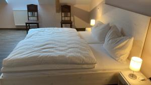 Cama o camas de una habitación en BürgerhausLöwen