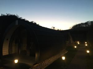 a group of cars driving down a road at night at Low Greenlands Holiday Park - Luxury House & Luxury Glamping Pods in Lancaster
