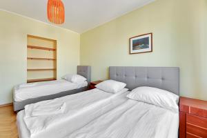 Posteľ alebo postele v izbe v ubytovaní Grand Apartments - Apartment for 7 people in Sopot