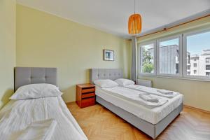 Posteľ alebo postele v izbe v ubytovaní Grand Apartments - Apartment for 7 people in Sopot