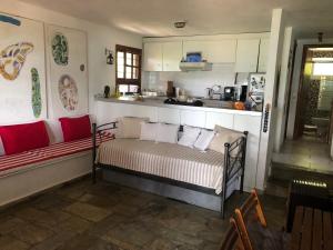 a room with a bed and a kitchen at Agrelia House in Ouranoupoli