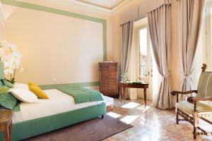 En eller flere senger på et rom på Luxury Bed and Breakfast Cerretani Palace