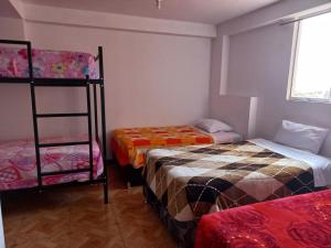 Voodi või voodid majutusasutuse Alegria s House Cusco toas